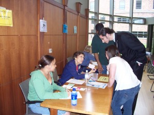 Welfare "recipients" use food stamps to make purchases at the Simulation's Food Pantry.